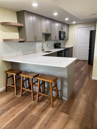 chic deck makeover, sleek appearance, meticulously refurbished, photorealistic, atop a mountain with panoramic views, highly detailed, clouds drifting by, high resolution, neutral grays and browns, diffuse daylight, shot with a macro lens